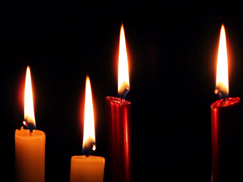 Anointed candles lit for spiritual ritual and intention setting
