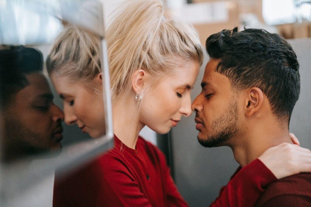 A man and woman in love with eyes closed, sharing an intimate emotional moment